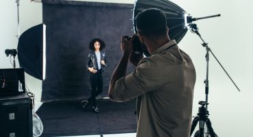 Photographer Doing A Photo Shoot In A Studio